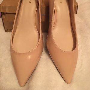 Nude patent pumps